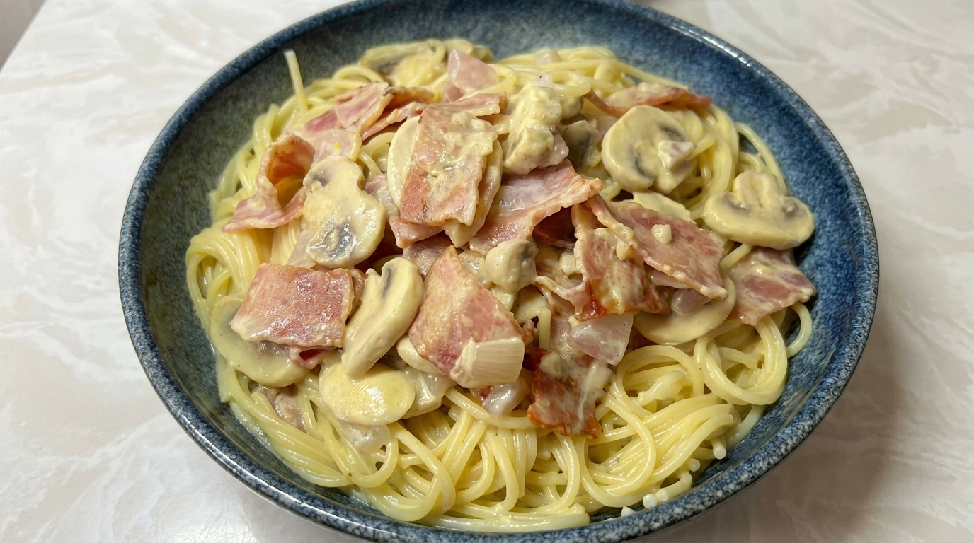 Cremige Spaghetti mit Speck und Champignons
